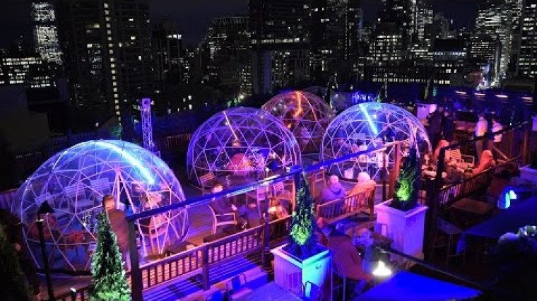 Visit 230 Fifths's winter rooftop igloos!
